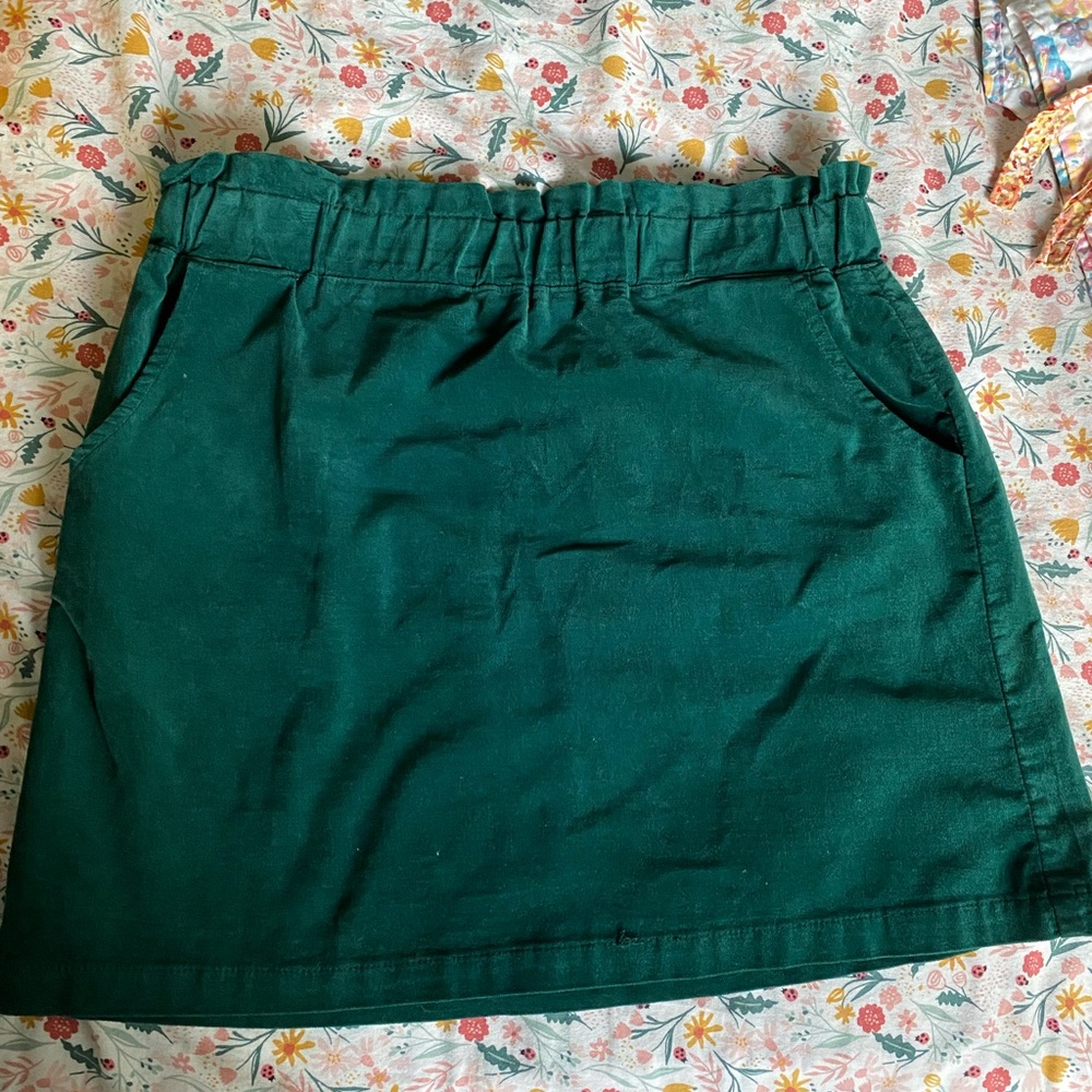 green mini skirt